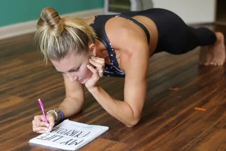 Lindsey journaling in plank pose